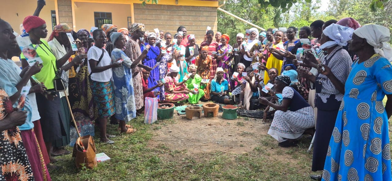 Widows' group gathered around clean cookstoves in Kendu Bay