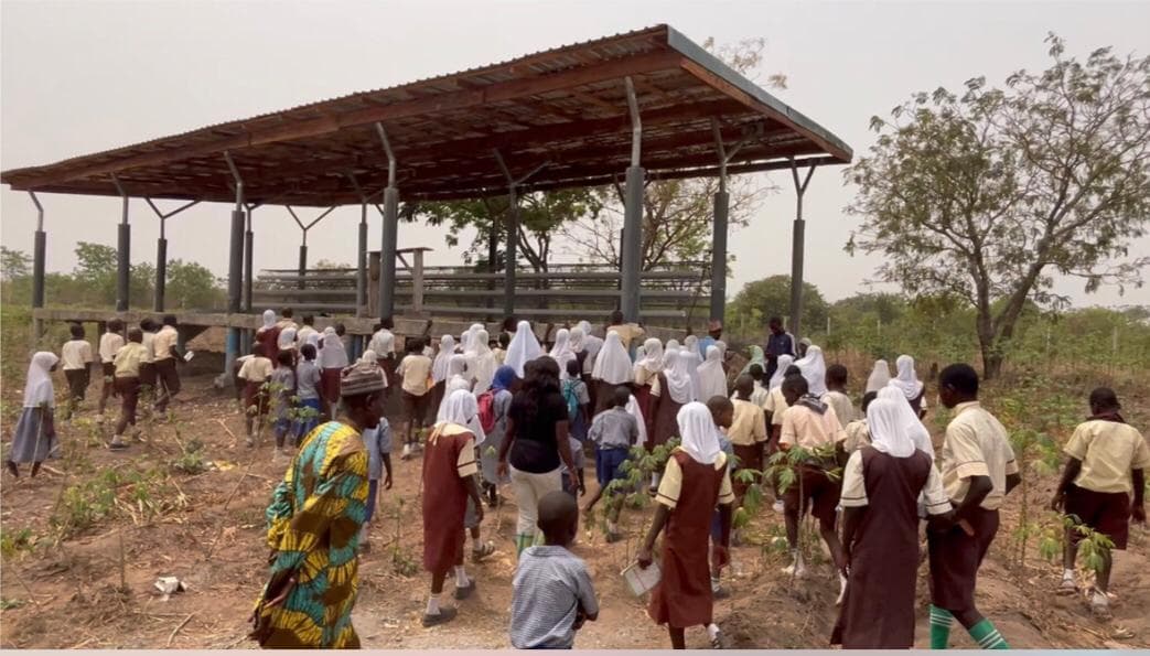 Students visiting the farm structures